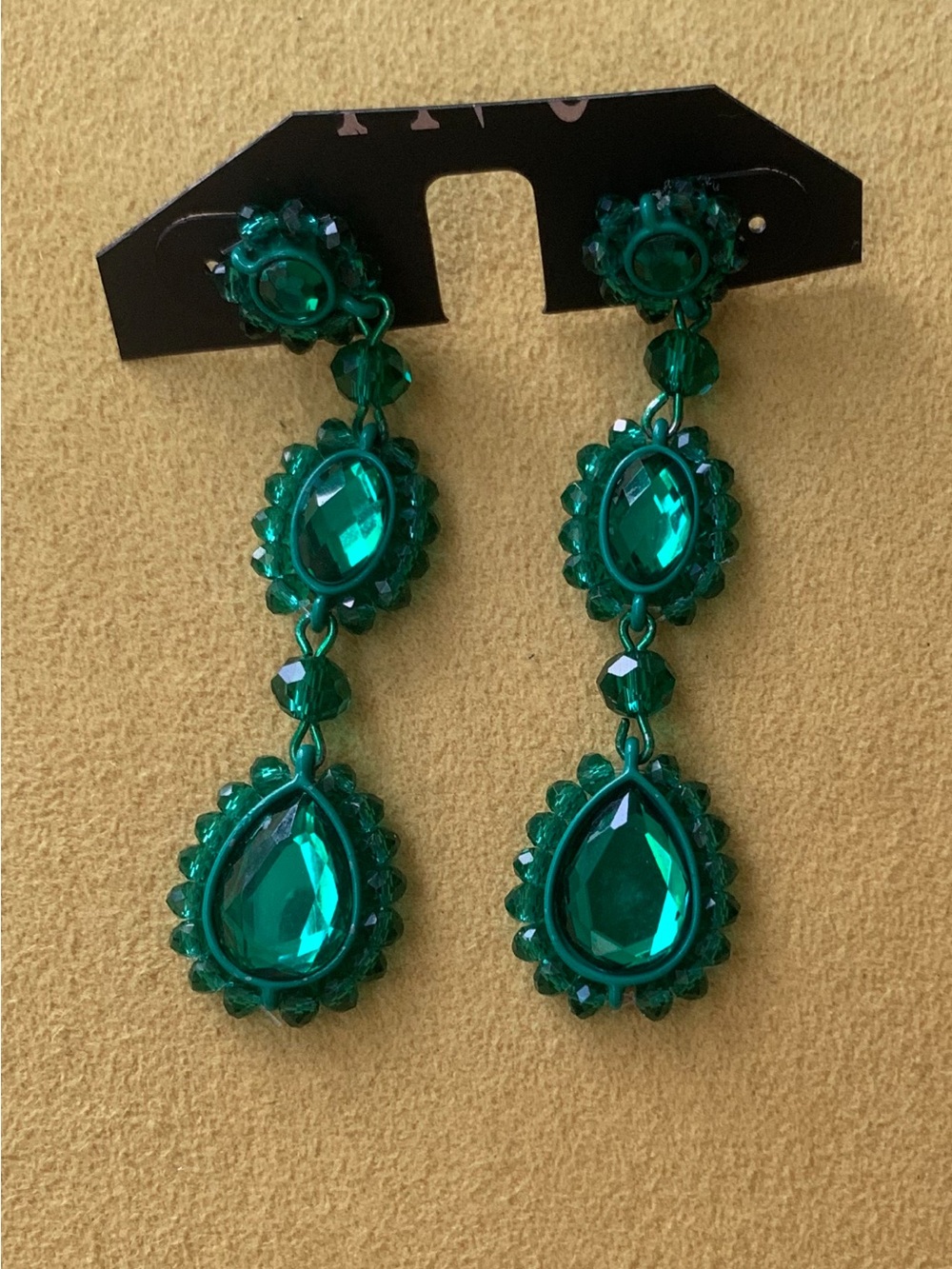 Never used .. Vintage emerald green long earring.